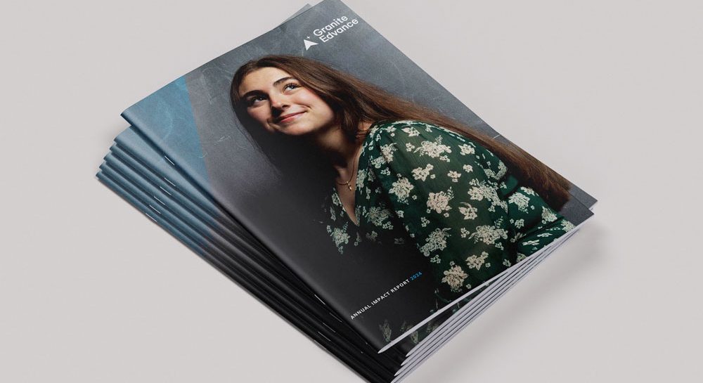 A stack of Granite Edvance's Annual Impact Report on a neutral background